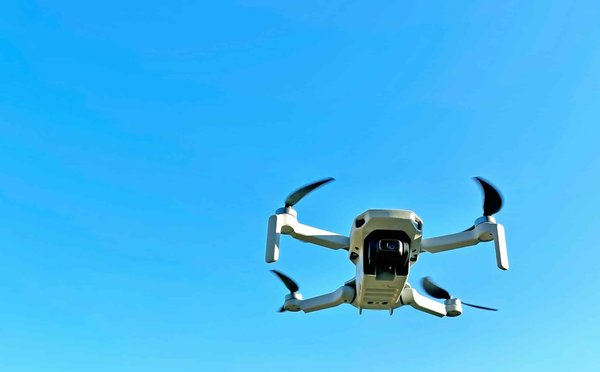 What specific regulations pertain to the operation of drones by a UK-based media company?